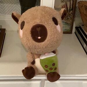 Adorable Brown Plush Toy with Green Accent